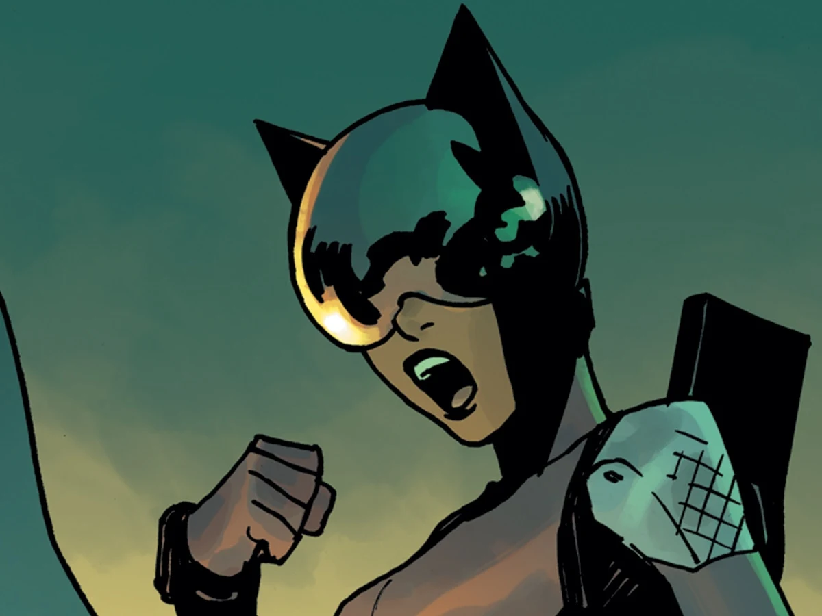 Absolute Catwoman in a black cat-eared mask and large goggles in official DC promotional artwork.