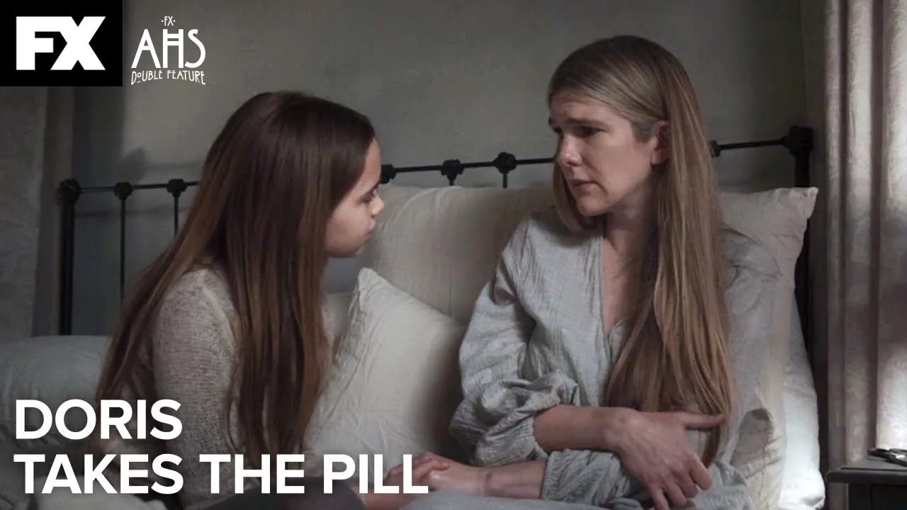 Alma sits beside Doris in bed under the FX Double Feature title in the official Doris Takes the Pill video thumbnail.