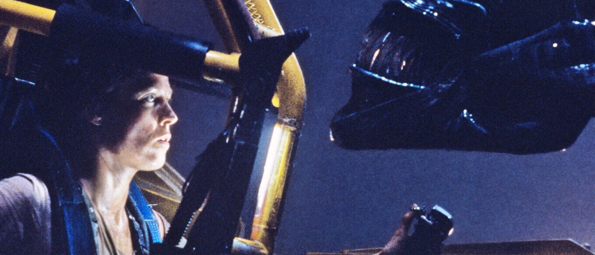 Ripley faces a xenomorph in an official Aliens promotional image.