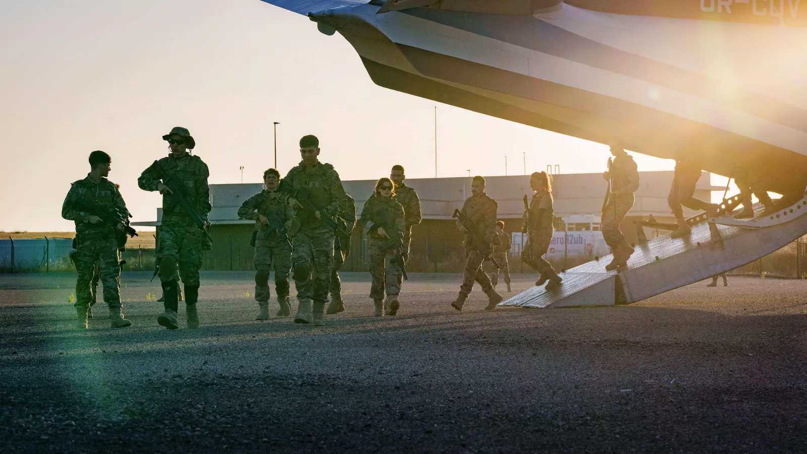 Armed survivors disembarking from an aircraft in an official Apocalypse Z: New World still.