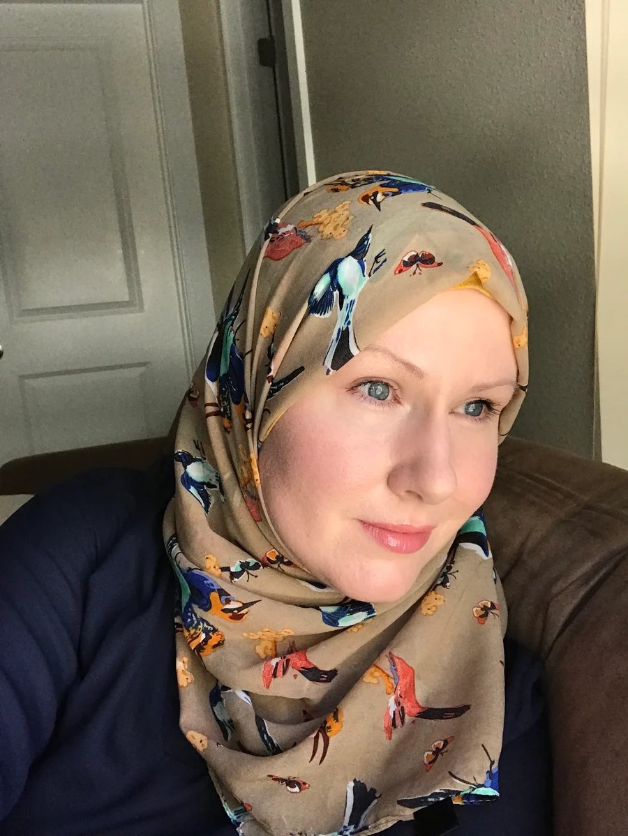 Captain Marvel writer G. Willow Wilson wearing a patterned headscarf in a July 2018 author portrait.