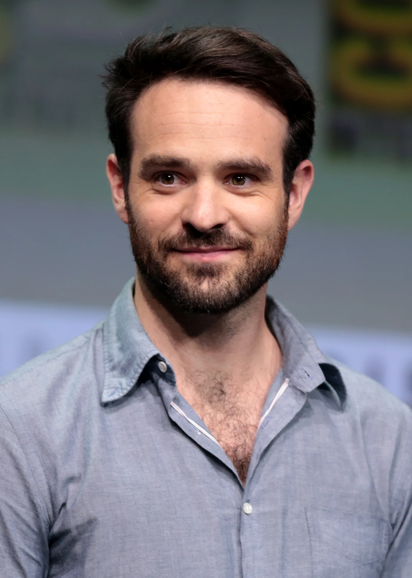 Charlie Cox in a blue shirt at San Diego Comic-Con in 2017.
