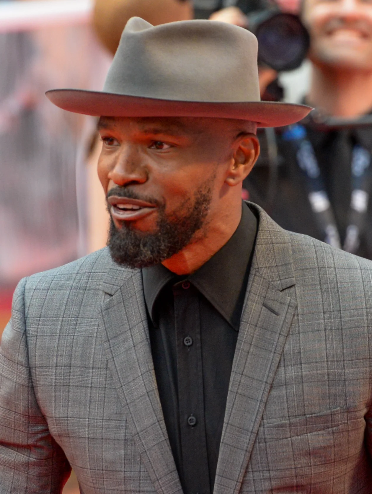 Jamie Foxx wearing a gray suit and hat at the 2019 Toronto International Film Festival.