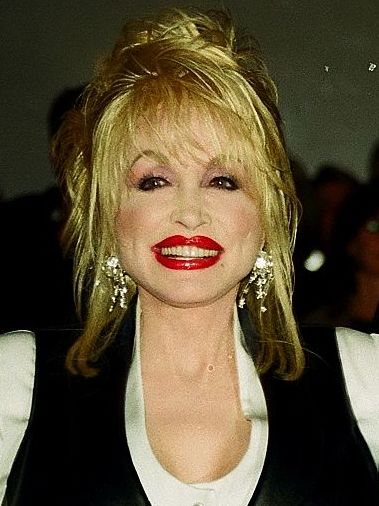 Dolly Parton smiling at a public event.