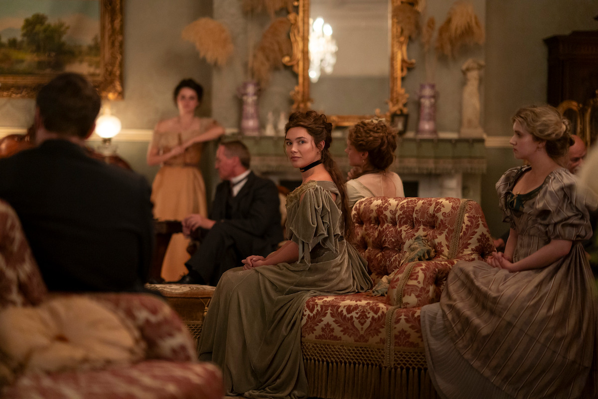 Florence Pugh as Cathy Ames sitting in an ornate room in Netflix’s East of Eden.