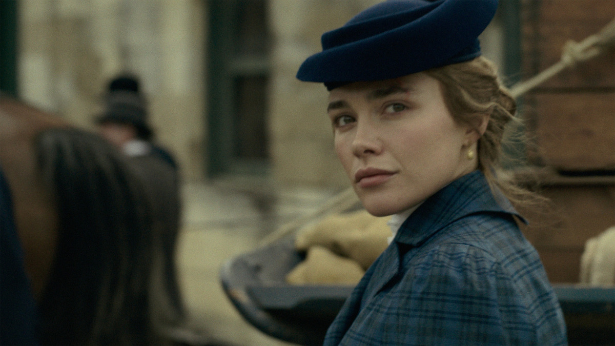 Florence Pugh as Cathy Ames looking back from a horse-drawn carriage in Netflix's East of Eden.