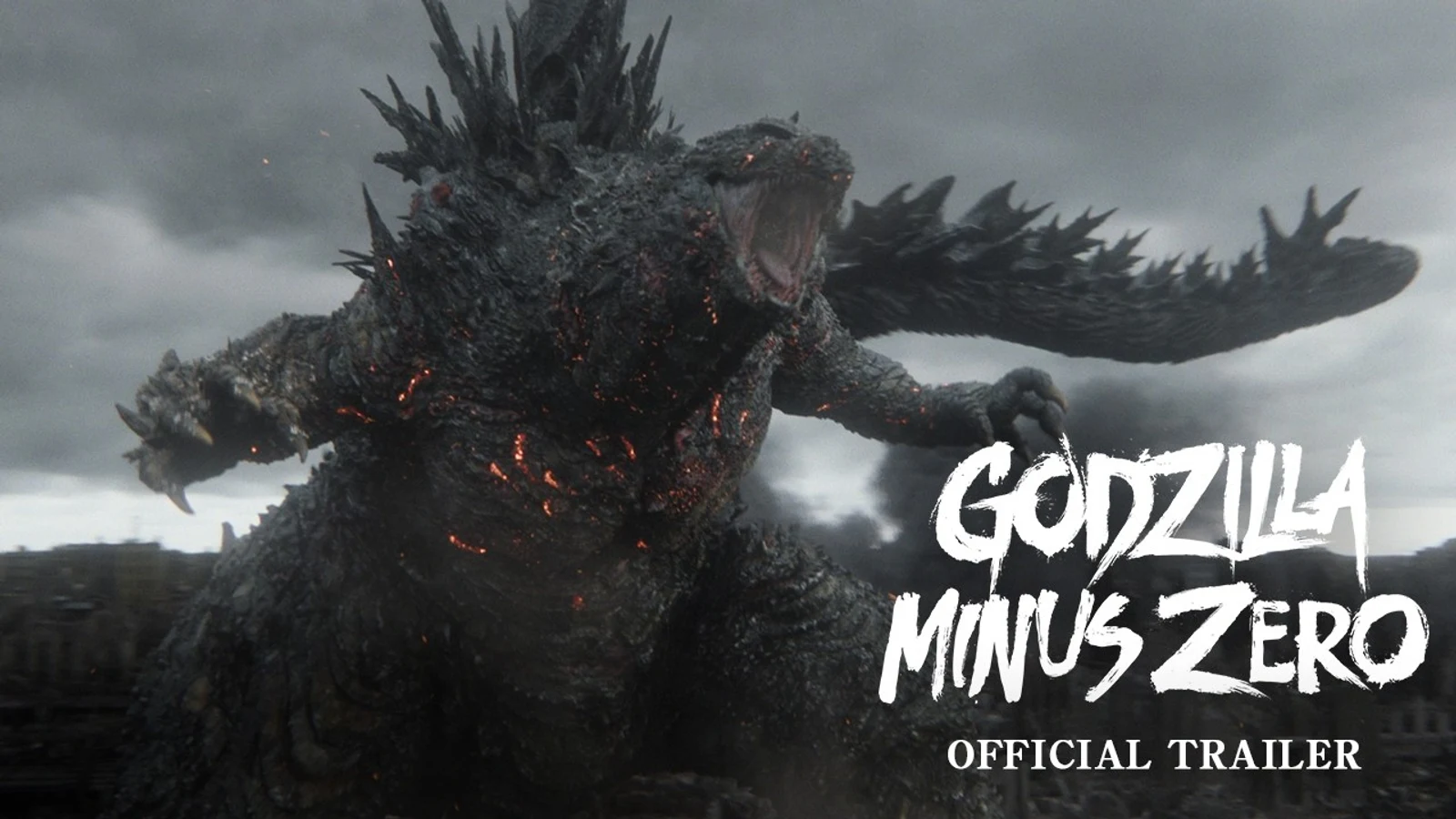 Official Godzilla Minus Zero trailer still showing Godzilla roaring amid a devastated city, beside the Godzilla Minus Zero official trailer title card.