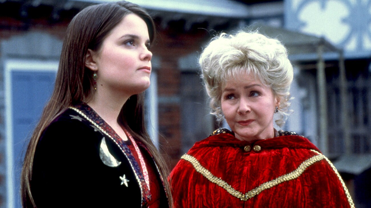 Kimberly J. Brown as Marnie Piper beside Debbie Reynolds as Aggie Cromwell in Halloweentown, wearing their witch costumes.