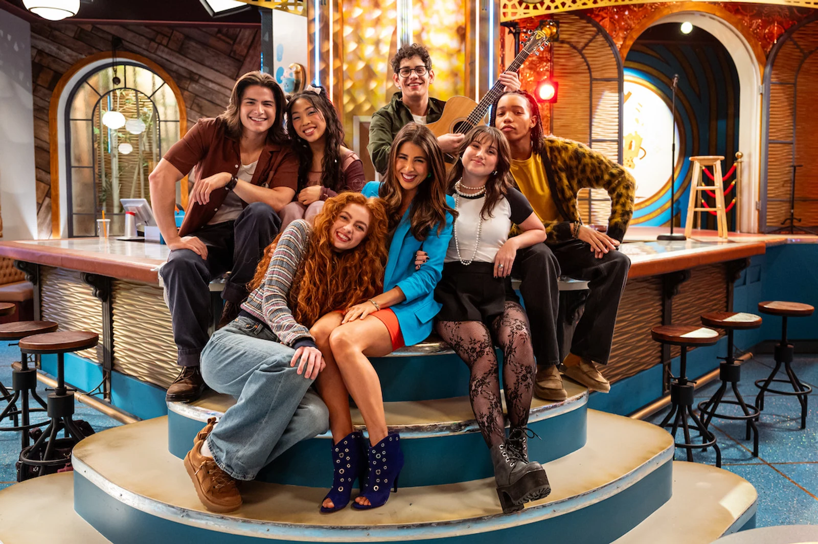 Official Netflix photo of the Hollywood Arts cast, including Daniella Monet as Trina Vega, posing together on the show's set.
