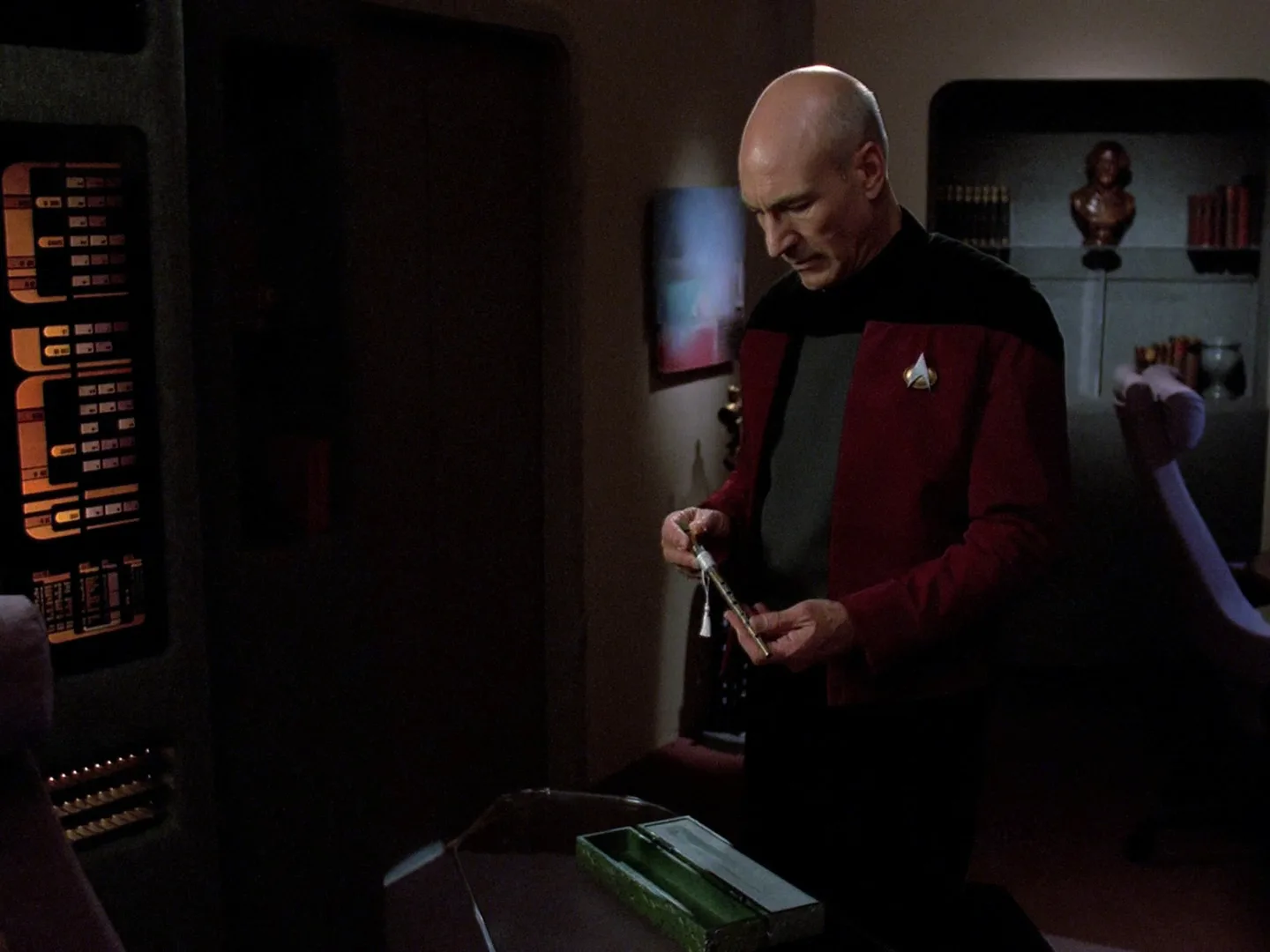 Captain Picard in his ready room holding a flute in a scene from the Star Trek: The Next Generation episode The Inner Light.