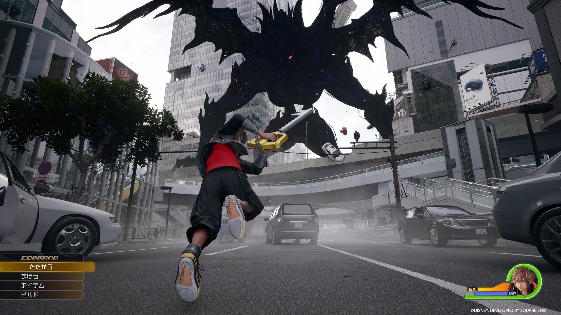 Sora running through the realistic streets of Quadratum toward a giant Heartless in Kingdom Hearts IV