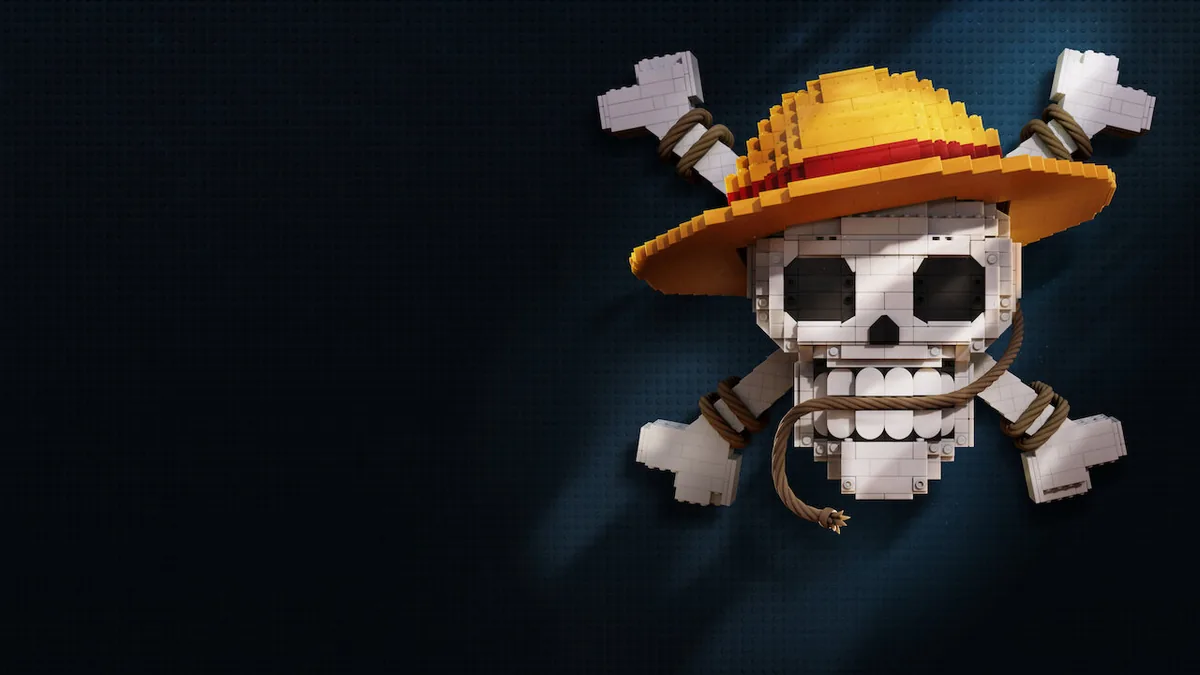 LEGO version of the Straw Hat Pirates' skull-and-crossbones emblem against a dark blue brick background.