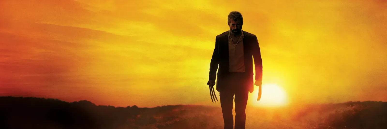 Official key art for Logan showing Hugh Jackman as Logan walking at sunset with his claws extended.