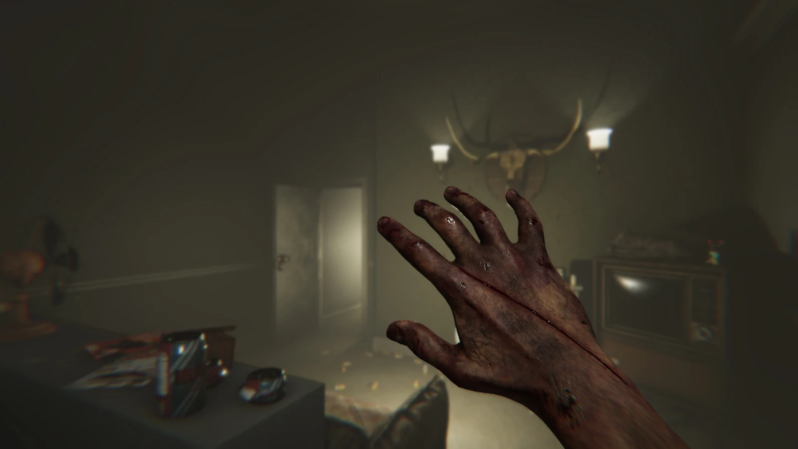 A first-person view of Luca's injured hand in a dim room in the original MADiSON game.