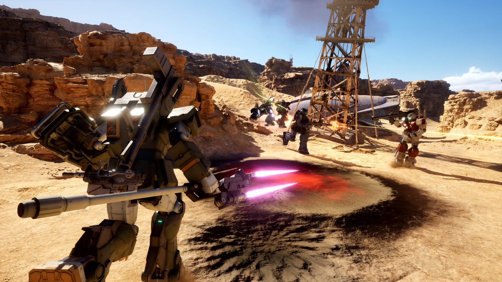 Mobile Suits exchange fire and beam attacks in a desert battlefield in an official Gundam Battle Operation 3 announcement screenshot.