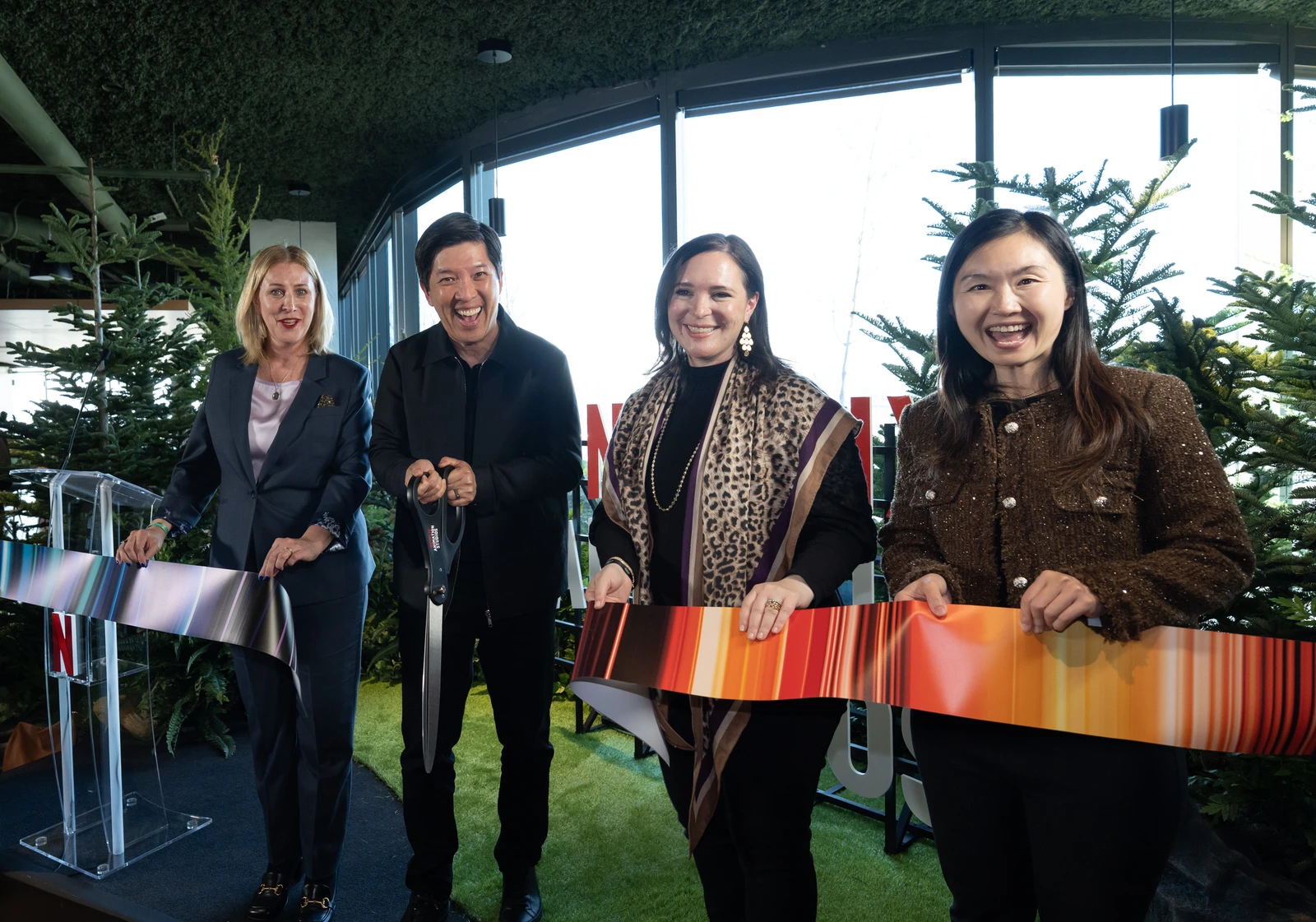 Dan Lin, second from left, at the ribbon-cutting for Netflix Animation Studios in Vancouver, alongside three fellow guests.