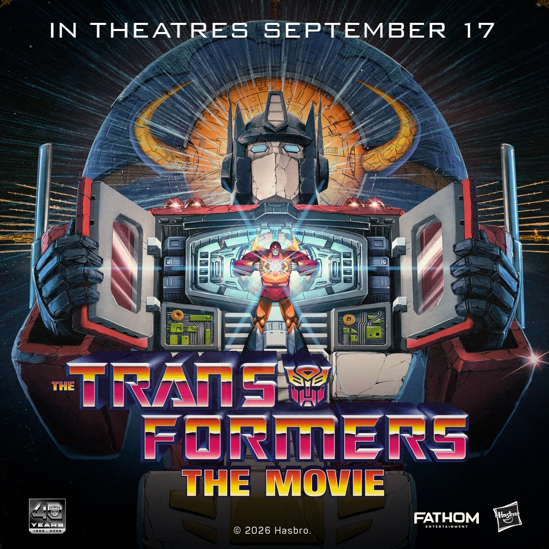 Official 40th-anniversary key art for The Transformers: The Movie, showing Optimus Prime's face and Hot Rod inside his chest compartment.