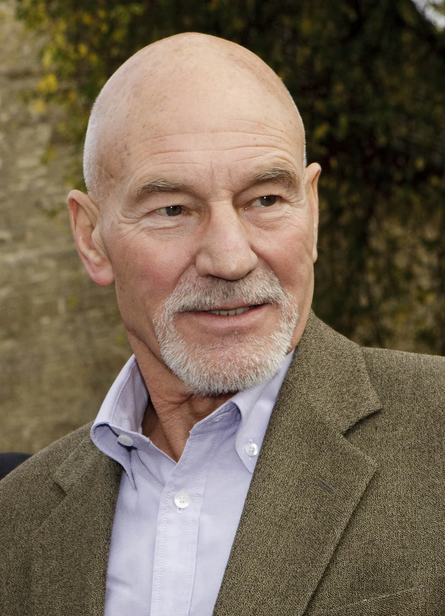 Patrick Stewart outdoors in a brown jacket in a portrait taken in 2009.