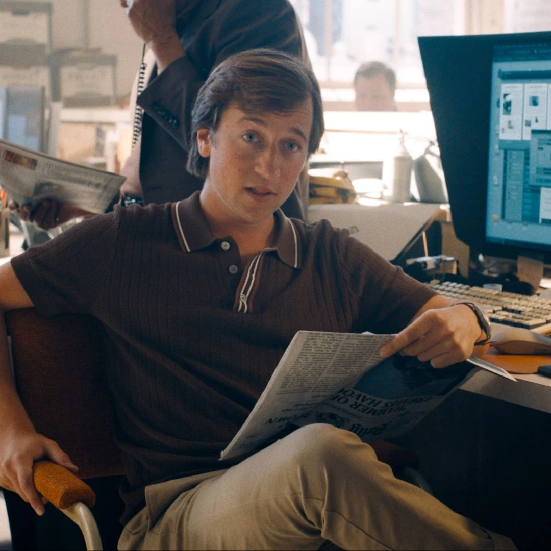 Skyler Gisondo as Jimmy Olsen in the Daily Planet newsroom in Superman.