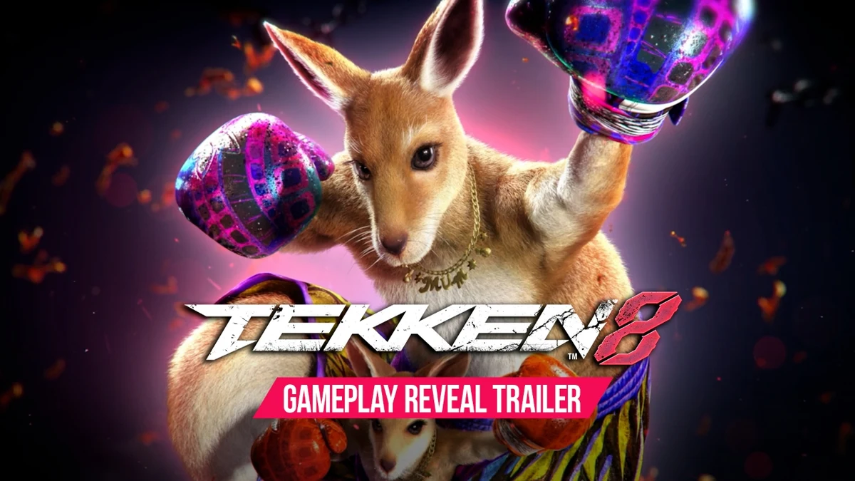 Official Tekken 8 gameplay-reveal artwork shows Roger Jr. in his mother’s pouch beneath her raised boxing gloves and the Tekken 8 logo.