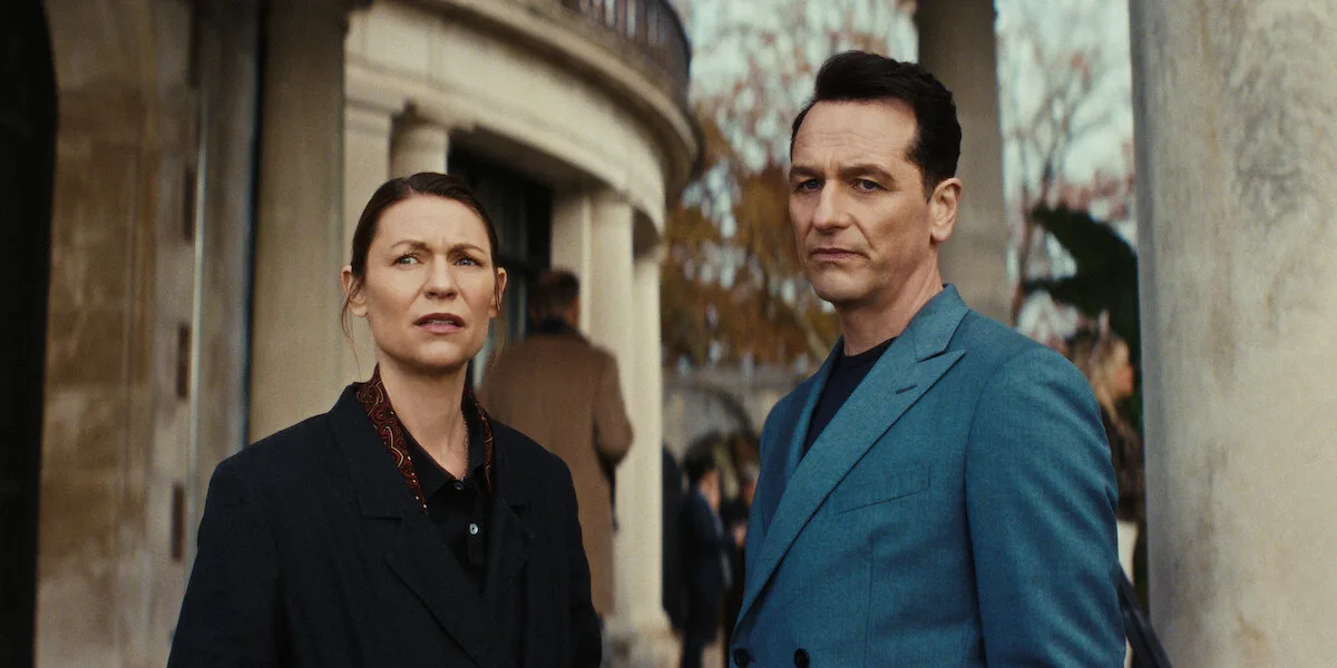 Claire Danes as Aggie Wiggs and Matthew Rhys as Nile Jarvis stand outside a columned house in a Season 1 still from Netflix's The Beast in Me.