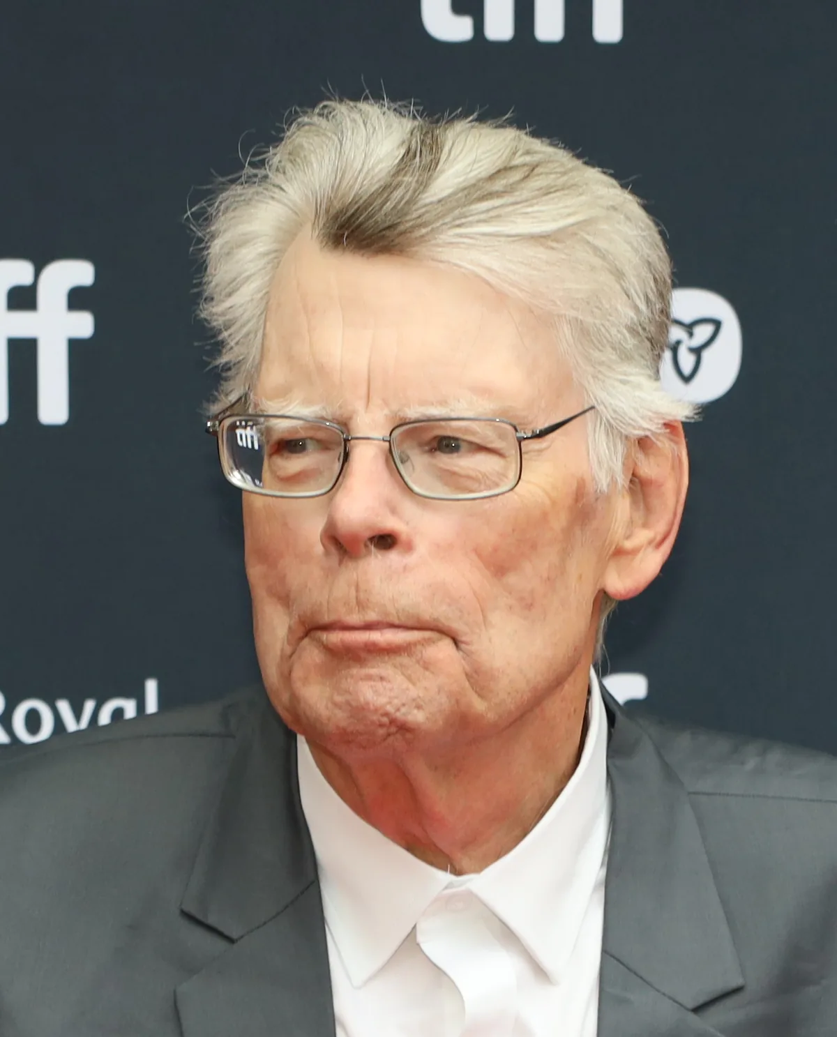 Stephen King wearing glasses and a gray suit jacket at the Toronto International Film Festival in 2024.