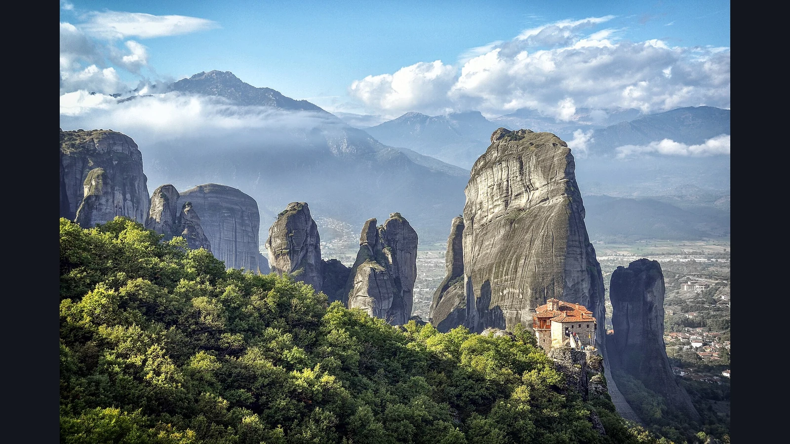 Meteora monasteries and tall sandstone pillars in Greece.