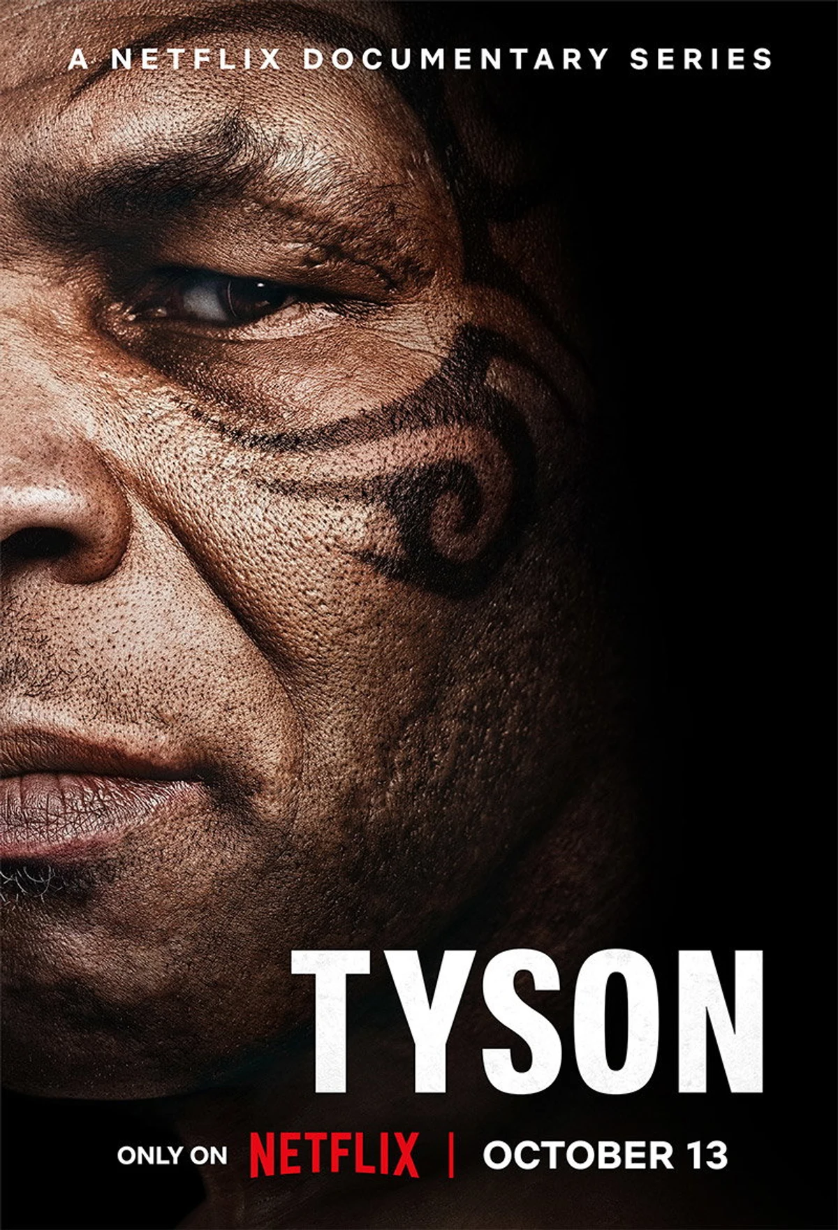 Official TYSON key art showing a close-up of Mike Tyson's face tattoo with the October 13 Netflix release date.