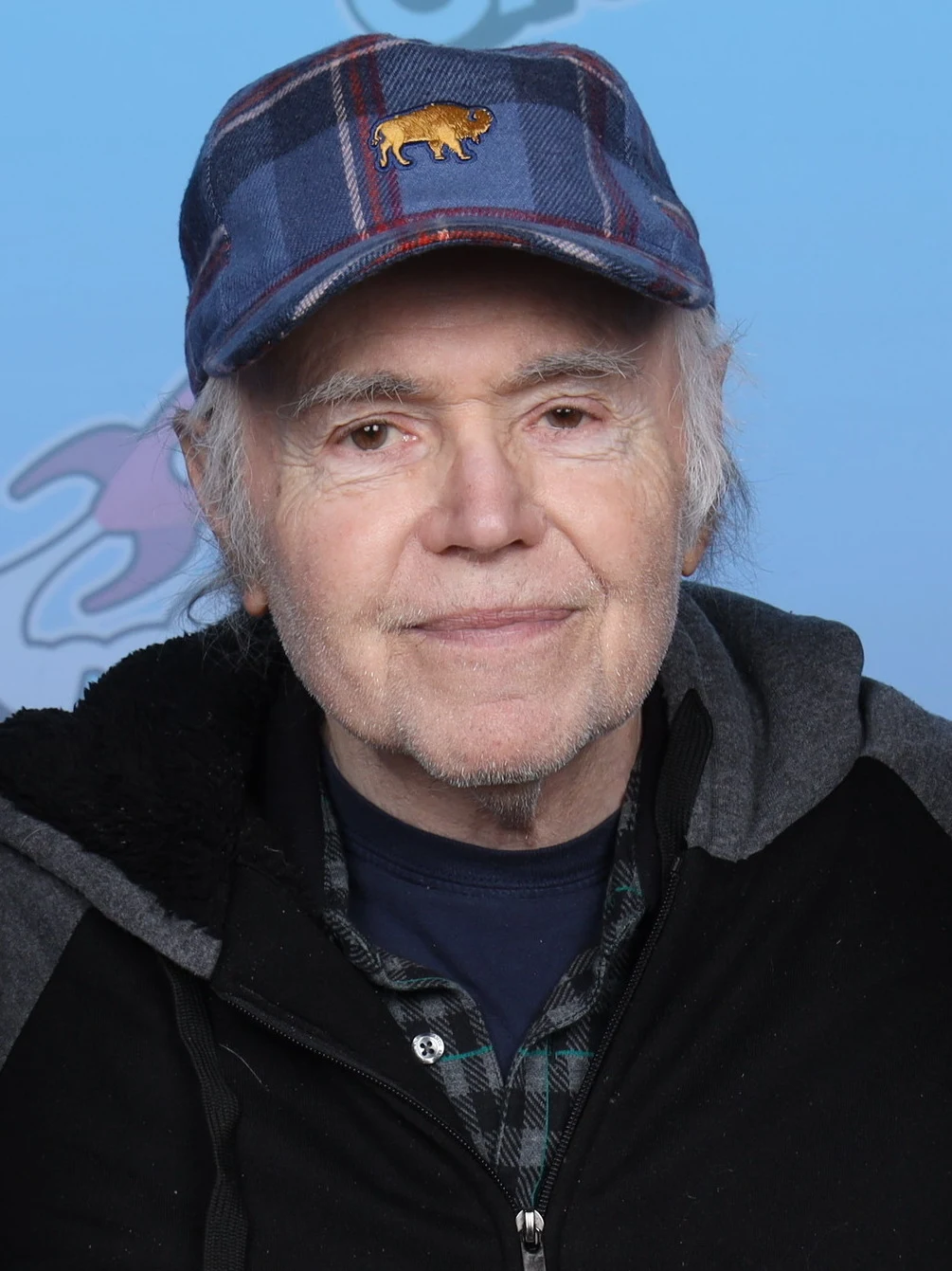 Walter Koenig photographed at GalaxyCon Richmond in 2023, wearing a blue cap and dark jacket.